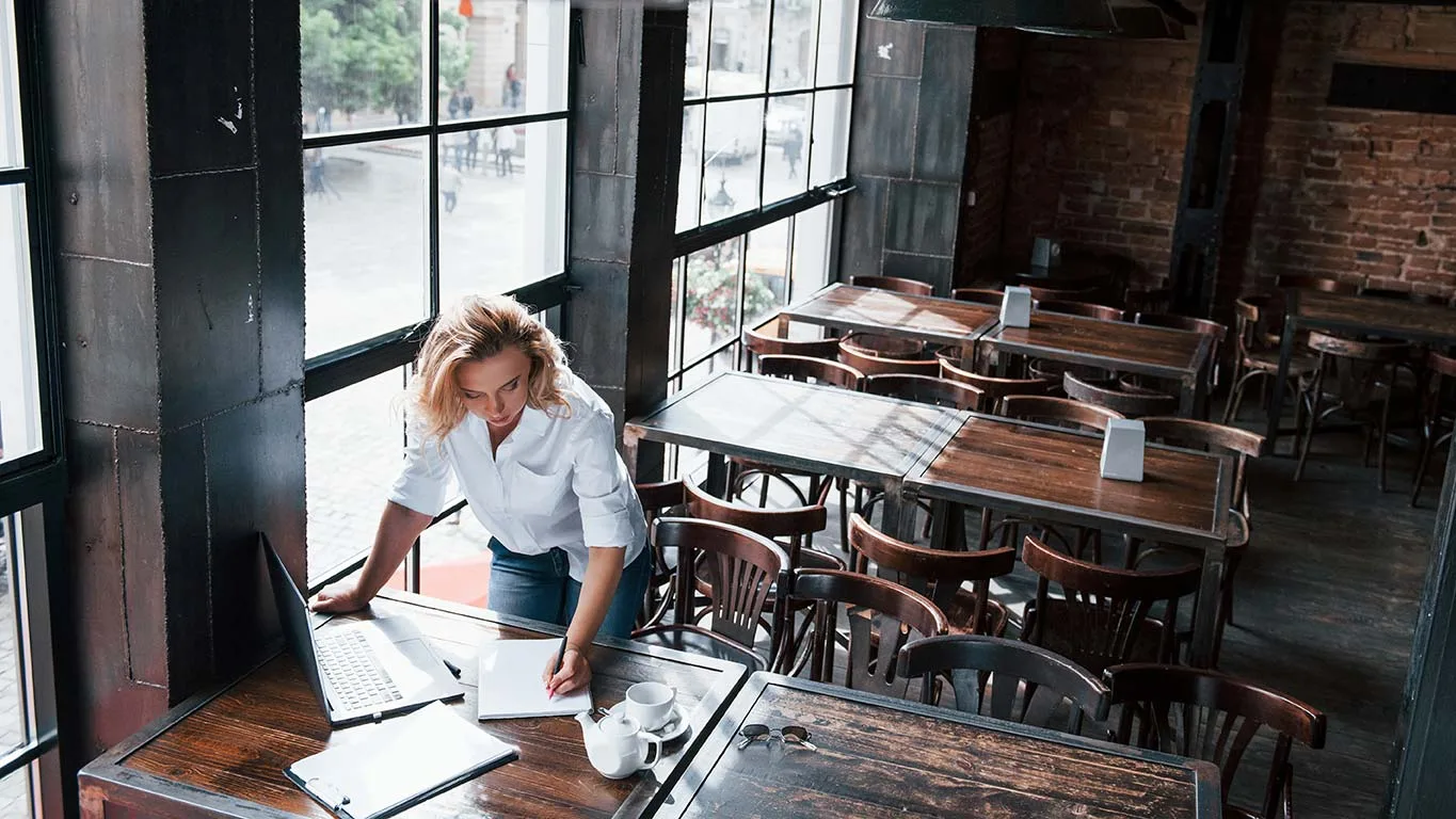 Restaurant Owner reviewing his closing checklist