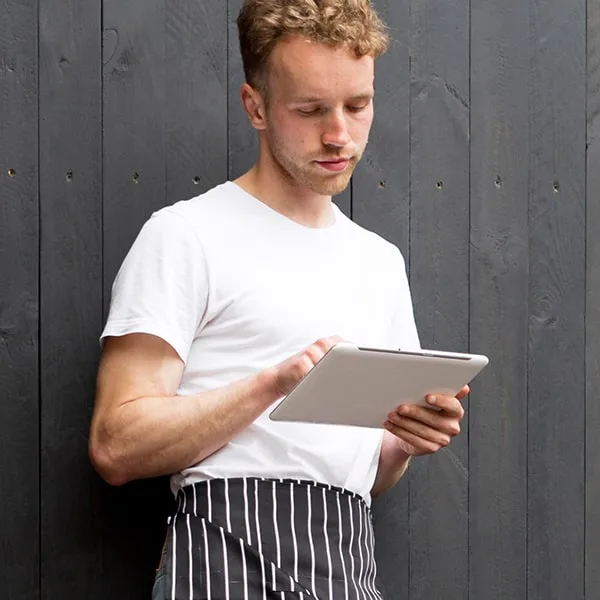 Restaurant Owner reviewing his opening checklist