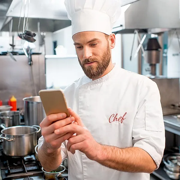 Chef checking his online ordering app to prep for the day